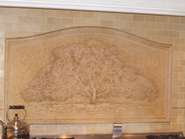 Better picture taken by designer of full mural showing stone frame and mini bricks all in Jerusalem stone behind stove in Oprah Winfrey's kitchen in her Montecito, Ca mansion of her favorite oak tree. Property called the Promised Land. Artist Jamie Santaniello jamiesantaniello.com Copyright©JS2003