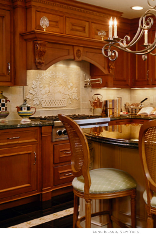 Artist Jamie Santaniello.
Long Island, New York.  Behind cook-top - “Santa Margarita Fruit Basket” handcarved Jerusalem stone slab 24” x 36” Santa Margarita tile line. / jamiesantaniello.com /   Copyright©JS2007